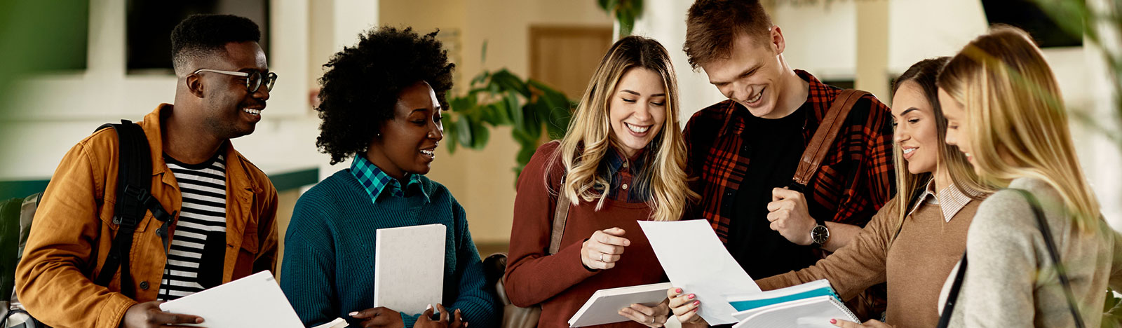 Group of colleges student reviewing a paper