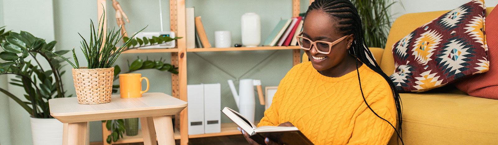 Young woman reading at home