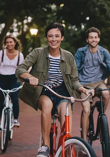 group of young adults riding bikes